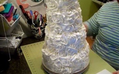 Watch a ribbon rose wedding cake being created